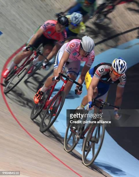 Belgian professional cyclist Kenny De Ketele is in front of German cyclist Moritz Augenstein during the 54th Six-Day Race in the ÖVB-Arena in Bremen,...