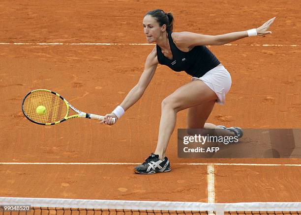 Arantxa Santonja of Spain returns the ball to Sorana Cirstea of Romania on their Estoril Open tennis match at Jamor Stadium, near Lisbon, on May 7,...