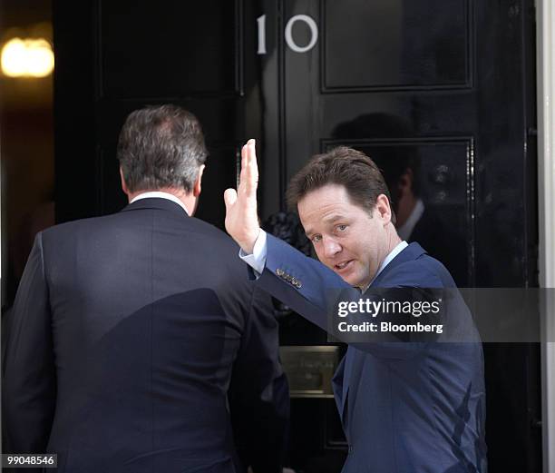 David Cameron, U.K. Prime minister, left, and Nick Clegg, U.K. Deputy prime minister, enter 10 Downing Street, in London, U.K., on Wednesday, May 12,...