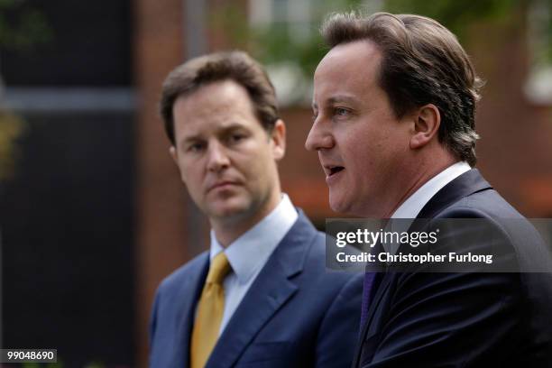 Prime Minister David Cameron and Deputy Prime Minister Nick Clegg hold their first joint press conference in the Downing Street garden on May 12,...