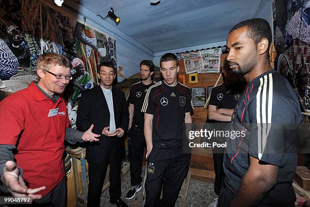 Project head Christian Wuetig and President of Missio Klaus Kraemer talk to players of team Germany Arne Firedrich, Lukas Podolski and Cacau during...