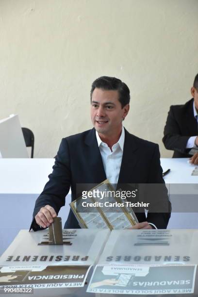 President of Mexico Enrique Pena Nieto casts his vote as part of the Mexico 2018 Presidential Election at School 'The Pipila' on July 1, 2018 in...