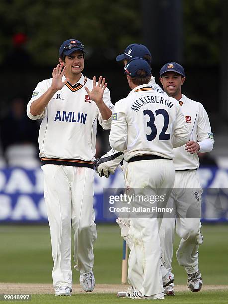 Alastair Cook of Essex congratulates Jaik Mickleburgh of Essex after running out Joseph Denly of Kent during day two of the LV= County Championship...