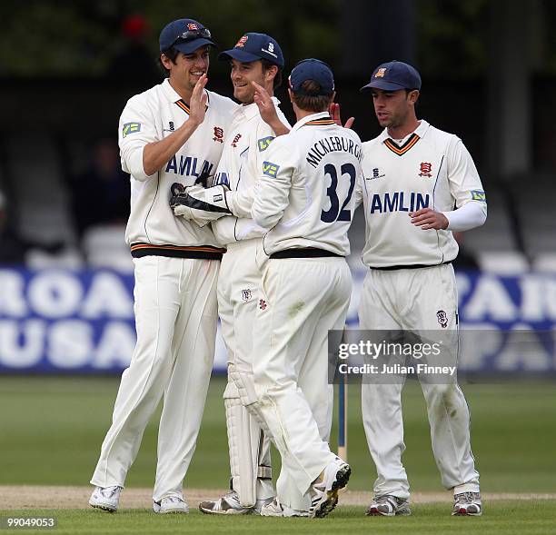 Alastair Cook of Essex congratulates Jaik Mickleburgh of Essex after running out Joseph Denly of Kent during day two of the LV= County Championship...