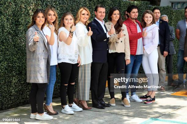 President Enrique Peña Nieto poses with her wife Angélica Rivera and his family after casting their votes during the 2018 Presidential Elections at...
