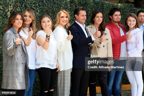 President Enrique Peña Nieto poses with her wife Angélica Rivera and his family after casting their votes during the 2018 Presidential Elections at...