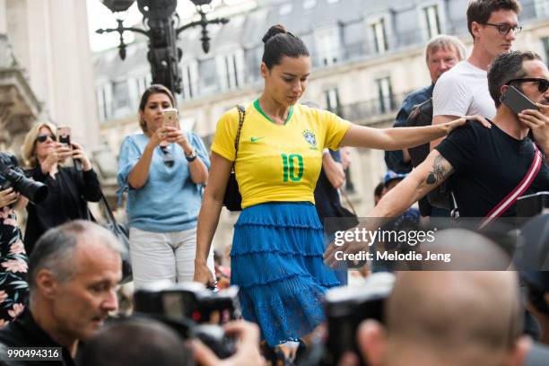Brazilian super model Adriana Lima wears a "Lima" Brasil soccer/football jersey during Couture Fall 2018 Fashion Week on July 2, 2018 in Paris,...