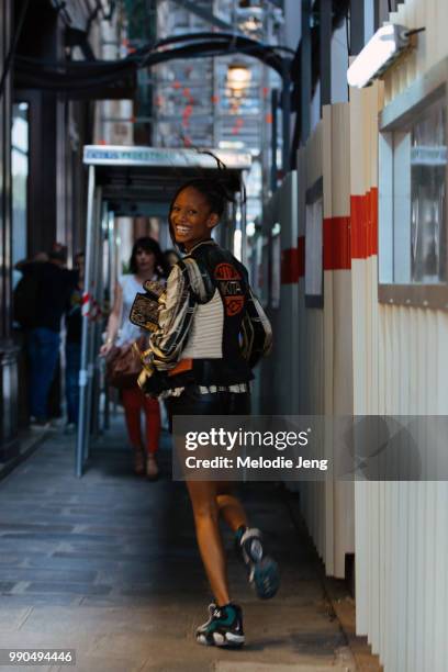 Model Adesuwa Aighewi runs to her next show during Couture Fall 2018 Fashion Week on July 2, 2018 in Paris, France.