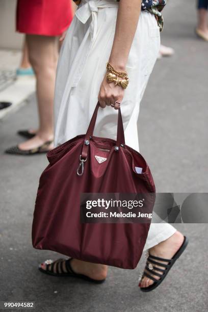 Caroline Issa carries a maroon Prada totebag during Couture Fall 2018 Fashion Week on July 2, 2018 in Paris, France.