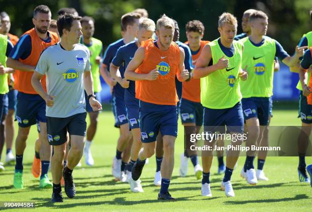 Fitnesscoach Henrik Kuchno, Fabian Lustenberger and Per Skjelbred of Hertha BSC run during the training at the Schenkendorfplatz on july 3, 2018 in...