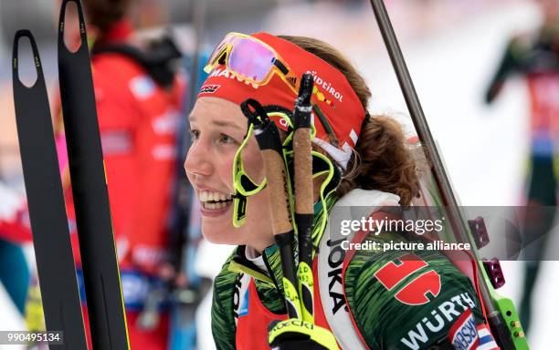 Laura Dahlmeier of Germany celebrates at the finish during the women's mass start event of the Biathlon World Cup at the Chiemgau Arena in...