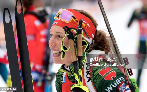 Laura Dahlmeier of Germany celebrates at the finish during the women's mass start event of the Biathlon World Cup at the Chiemgau Arena in...