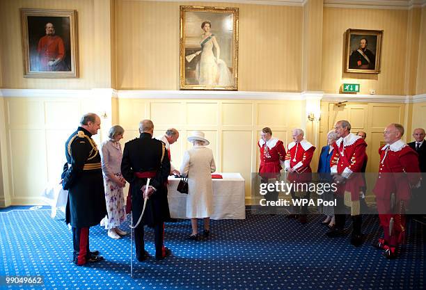 Queen Elizabeth II visits the Company of Pikemen and Musketeers at HAC Armoury House on May 12, 2010 in London, England.