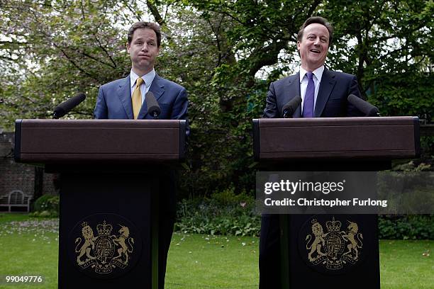 Prime Minister David Cameron and Deputy Prime Minister Nick Clegg share a joke as they hold their first joint press conference in the Downing Street...