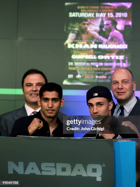 Amir Khan and Paulie Malignaggi pose after ringing the bell inside the NASDAQ building in Times Square ahead of their WBA title fight at Madison...