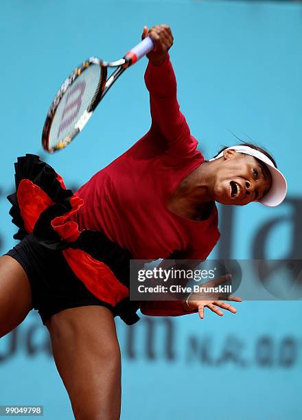 Venus Williams of the USA serves against Francesca Schiavone of Italy in their third round match during the Mutua Madrilena Madrid Open tennis...