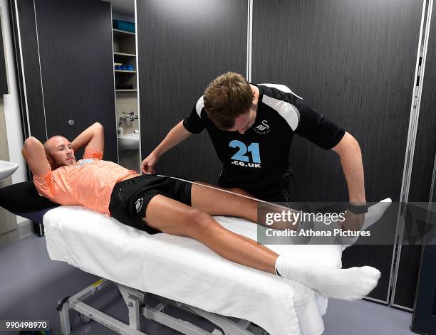 Mike van der Hoorn is measured during the Swansea City Players Return to Pre-Season Training at The Fairwood Training Ground on July 02, 2018 in...