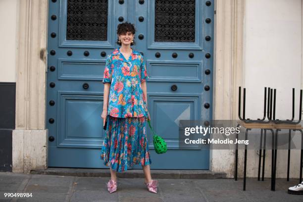 Chloe Hill wears a floral blue Romance Was Born outfit, Ganni green bag, and Midnight 00 shoes by Ada Kokosar during Couture Fall 2018 Fashion Week...