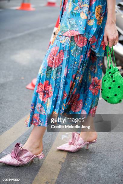 Chloe Hill wears a floral blue Romance Was Born outfit, Ganni green bag, and Midnight 00 shoes by Ada Kokosar during Couture Fall 2018 Fashion Week...