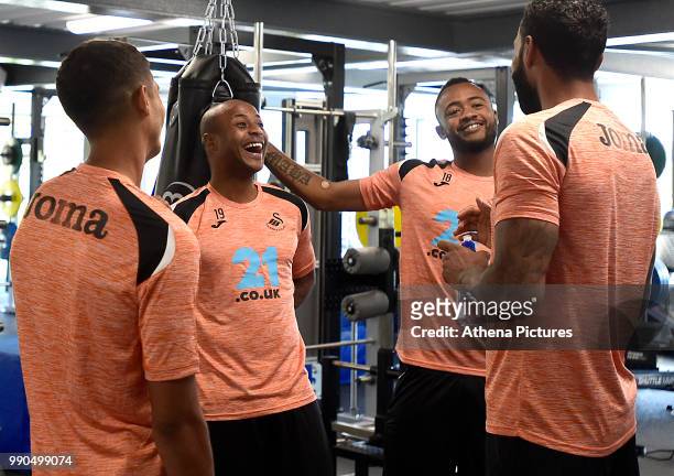 Kyle Naughton, Andre Ayew, Jordan Ayew and Kyle Bartley share a joke in the gym during the Swansea City Players Return to Pre-Season Training at The...