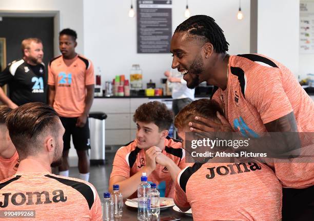 Leroy Fer shares a joke with team mates in the canteen during the Swansea City Players Return to Pre-Season Training at The Fairwood Training Ground...