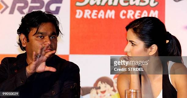 Indian Bollywood actress Katrina Kaif listens to musician A.R. Rahman at a product launch ceremony in Mumbai on May 12, 2010. AFP PHOTO/STR