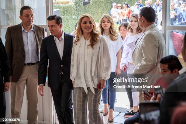 President Enrique Peña Nieto arrives with her wife Angelica Rivera and his family to cast their votes during the 2018 Presidential Elections at...