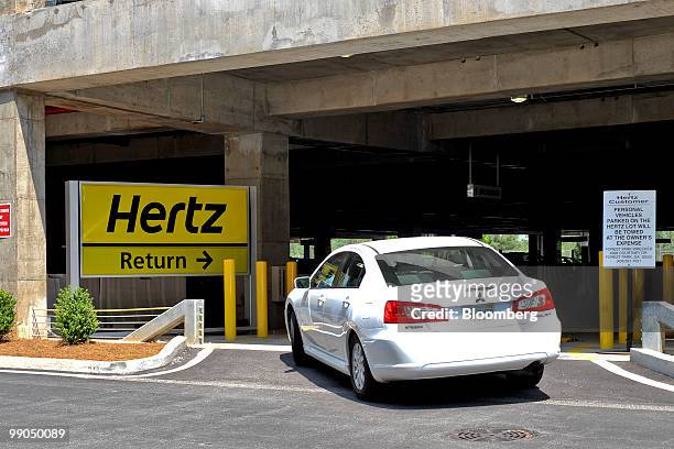 Car pulls into the Hertz rental car return area at Hartsfield-Jackson Atlanta International Airport in Atlanta, Georgia, U.S., on Friday, May 7,...