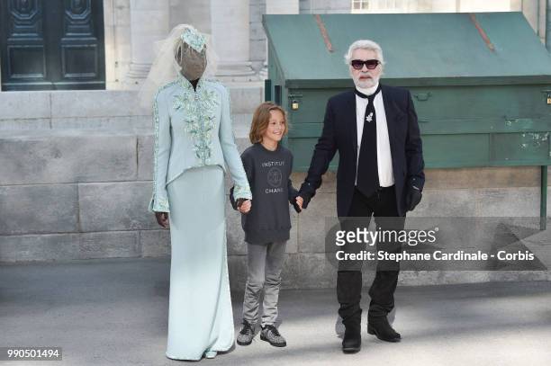 Adut Akech, Hudson Kroenig Chanel Designer Karl Lagerfeld walks the runway during the Chanel Haute Couture Fall Winter 2018/2019 show as part of...