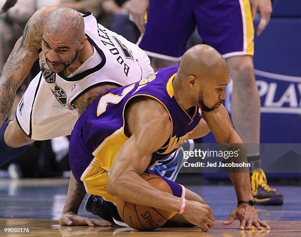 Derek Fisher of the Los Angeles Lakers scrambles for the ball with Carlos Boozer of the Utah Jazz during Game Four of the Western Conference...