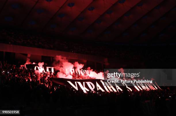 Smoke rises from burning flares highlighting banners 'Oleh Sentsov! Ukraine is with You!' during the Oleh, Ukraina z toboiu! action held in support...