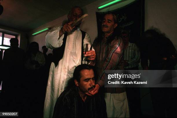 During remembrance ceremony a Kasnazani dervish, while in trance, has two knives hammered into his skull by the Shaikh of the order. Kasnazani...