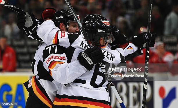 Nicolai Goc of Germany celebrate with his team mate's after he scores his team's 3rd goal during the IIHF World Championship group A match between...