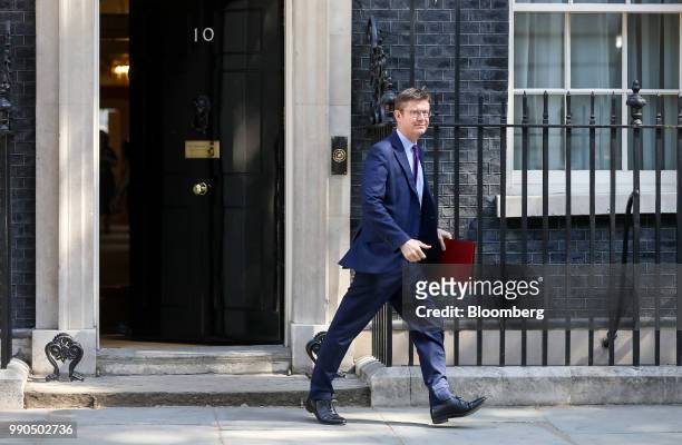 Greg Clark, U.K. Business secretary, leaves after attending a meeting of cabinet minsters at number 10 Downing Street in London, U.K., on Tuesday,...