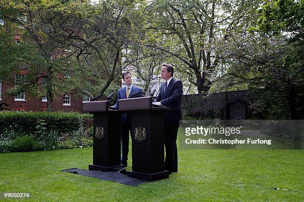 Prime Minister David Cameron and Deputy Prime Minister Nick Clegg hold their first joint press conference in the Downing Street garden on May 12,...