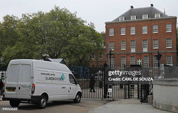 Removal men arrive at the rear of Downing Street, the official residence of the British Prime Minister David Cameron, in central London, on May 12,...