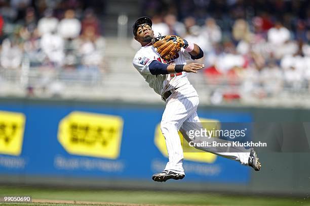 Alexi Casilla of the Minnesota Twins fields a ball hit by the Baltimore Orioles on May 9, 2010 at Target Field in Minneapolis, Minnesota. The Twins...