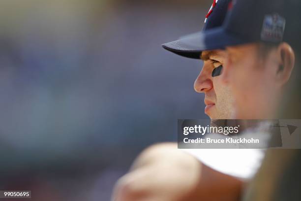 Joe Mauer of the Minnesota Twins watches his team play against the Baltimore Orioles while he was a designated hitter on May 9, 2010 at Target Field...