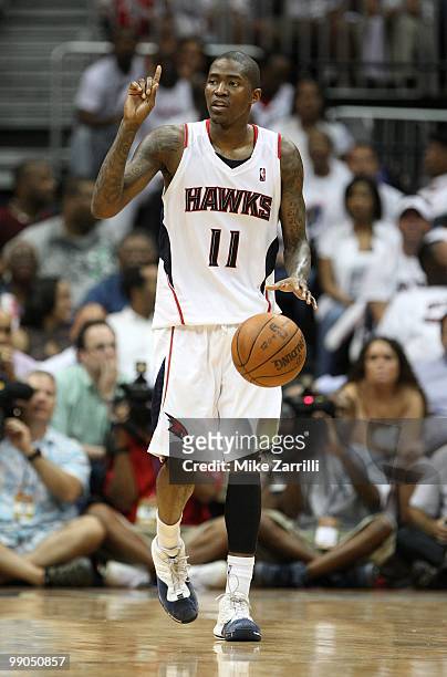 Guard Jamal Crawford of the Atlanta Hawks dribbles the ball during Game Seven of the Eastern Conference Quarterfinals between the Milwaukee Bucks and...