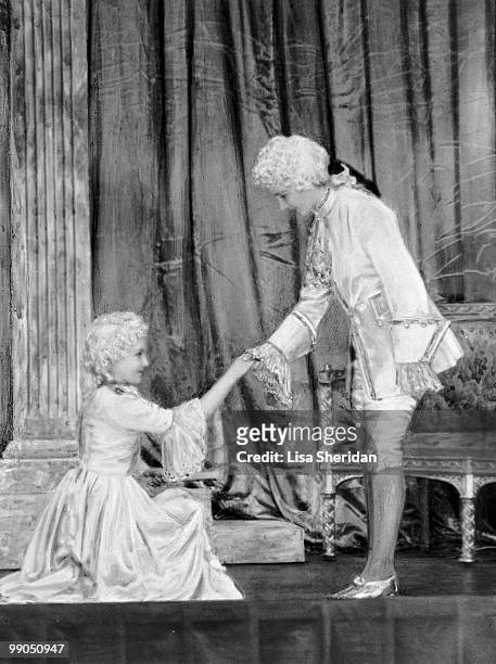 Princess Elizabeth dressed as Prince Charming with Princess Margaret as Cinderella during a royal pantomime at Windsor Castle, Berkshire, Great...