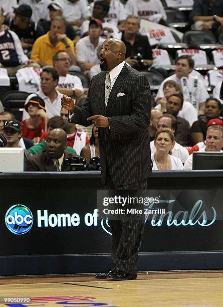 Atlanta Hawks head coach Mike Woodson yells instructions at his team on the court during Game Seven of the Eastern Conference Quarterfinals between...