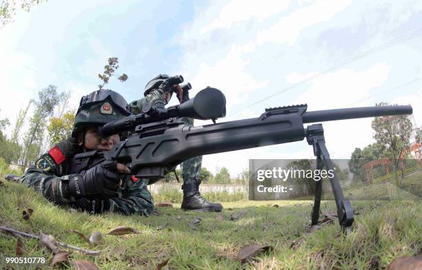 This photo taken on July 1, 2018 shows Chinese paramilitary personnel training in Chenzhou in China's central Hunan province. / China OUT