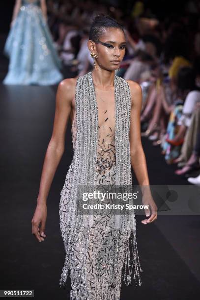 Model Binx Walton walks the runway during the George Hobeika Haute Couture Fall Winter 2018/2019 show as part of Paris Fashion Week on July 2, 2018...