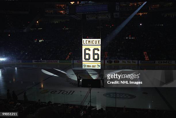 The banner of retired Pittsburgh Penguins owner Mario Lemieux is unveiled as he returns from his retirement on December 27, 2000 in the game against...