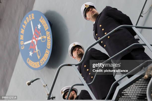 Three marine soldiers stand on board the marine ship "Hessen" at the naval base in Wilhelmshaven, Germany, 15 January 2018. The frigate "Hessen" will...