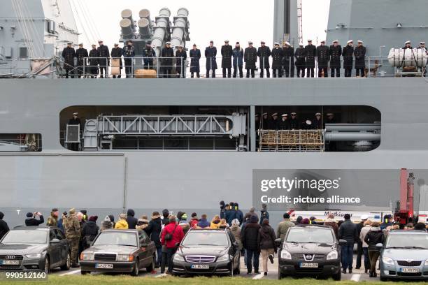 Marine soldiers stand on board the marine ship "Hessen" and wave goodbye to their families at the naval base in Wilhelmshaven, Germany, 15 January...