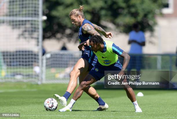 Alexander Esswein and Valentino Lazaro of Hertha BSC fight for the ball during a training session at the Schenkendorfplatz on July 3, 2018 in Berlin,...