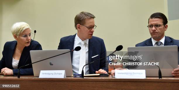 Anja Sturm, Wolfgang Heer and Wolfgang Stahl, all three lawyers of defendant Beate Zschaepe, wait prior to the continuation of her trial at a...