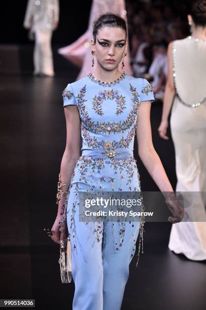 Model walks the runway during the George Hobeika Haute Couture Fall Winter 2018/2019 show as part of Paris Fashion Week on July 2, 2018 in Paris,...