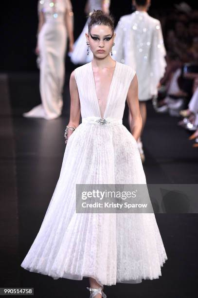 Model walks the runway during the George Hobeika Haute Couture Fall Winter 2018/2019 show as part of Paris Fashion Week on July 2, 2018 in Paris,...